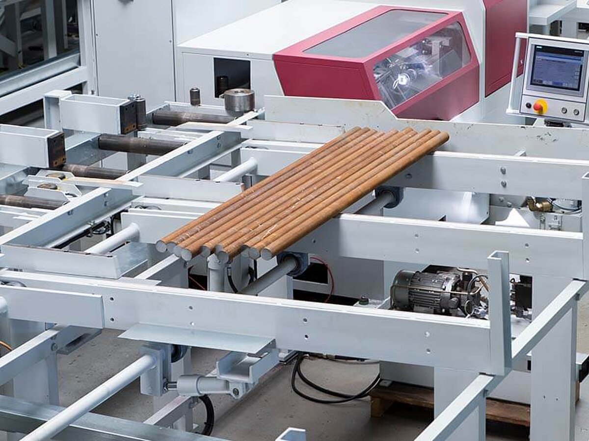 Bar loading magazine for round material